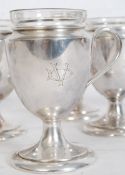 A set of early 20th century Mappin & Webb silver plate goblets having inset glass liners. Stamped to