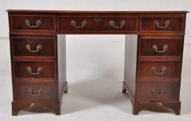 Antique Georgian style mahogany twin pedestal office writing desk. The pedestal desk having a series