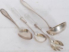 A good early 20th century WMF collection to include glass handled salad servers, a ladel and a