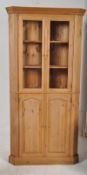 A good quality large country pine corner cabinet. Plinth base with cupboard under glazed display
