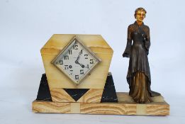 A 1930's Art Deco French marble and spelter mantel clockby J Remond of Morlaix. The 8 day movement