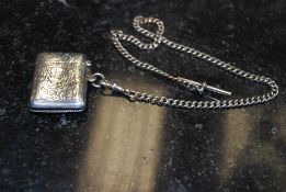 A vesta and a silver chain