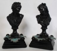 A pair of cast metal busts of continental origin being signed to the underside, illegible. Raised on
