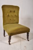 A Victorian mahogany bedroom nursing chair on turned legs with green velour upholstered frame.