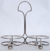 A good 20th century Walker & Hall silver hallmarked wine bottle holder raised on bun feet having