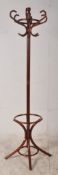 A dark wood bentwood Thonet style hat / coat stand. Shaped supports with central column and hooks