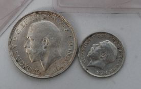 Coins GB. George V, sixpence, 1919, GF together with a  George V, florin, 1918, GF, (2 xcoins).