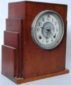 A 1930's Art Deco mahogany mantel clock having an earlier Atsonia clock movement striking on a gong