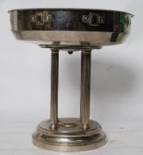 A 20th century silver plate fruit bowl. The circular base with corinthium column supports having