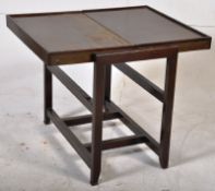 A 1950's metamorphic folding bookcase / table by Besway. Lozenge makers mark to front. 80cm x 69cm x