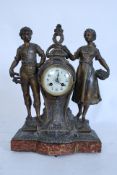 A 1930's French spelter and marble mantel clock. The 8 day movement striking on a bell complete with