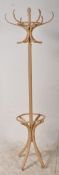 A light wood bentwood Thonet style hat / coat stand. Shaped supports with central column and hooks