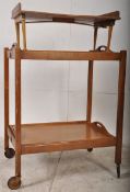 A mid 20th century Danish influence folding butlers trolley having twin tiers with removeable trays,