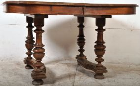A 19th century French walnut dining table of extending form. Raised on turned supports with