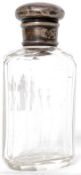 A solid silver topped cut glass scent bottle hallmarked for 1885 being 10cms tall 91g