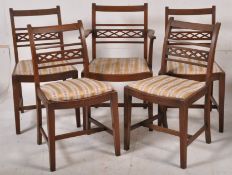 A set of 4 mahogany 20th century dining chairs having lattice style backrests with drop in seats.