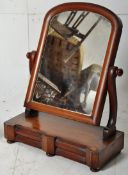 A Victorian mahogany dressing table swing mirror on bun squat feet with opening twin drawers to