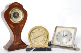 A 1930's Art Deco travel clock with sunburst face, a chrome desktop clock and a mahogany