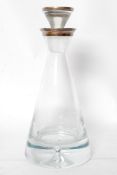 A hallmarked silver cut glass decanter. The heavy cut glass decanter with silver collar and stopper