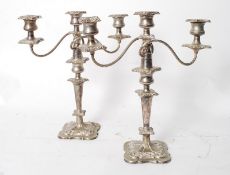 A pair of Art Nouveau silver plate candlestick holders, with spiral twist natural form arms