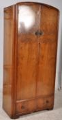 A 1940,s Queen Anne revival Art Deco walnut single wardrobe. Twin doors with open storage within /