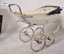 An early 20th century enamel painted silver cross pram condition with working hood, sat on chrome