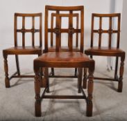 A set of 4 1930,s Art Deco oak dining chairs. Raised on cup and cover supports having drop in