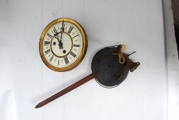 An early 20th century clock face and movement with numerals to dial and brass movement to reverse.