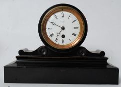 A Victorian ebonised Allen of Bath mantel clock. The enamel face set with roman numerals, the dial