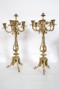 A pair of 19th century five branch brass candelabra