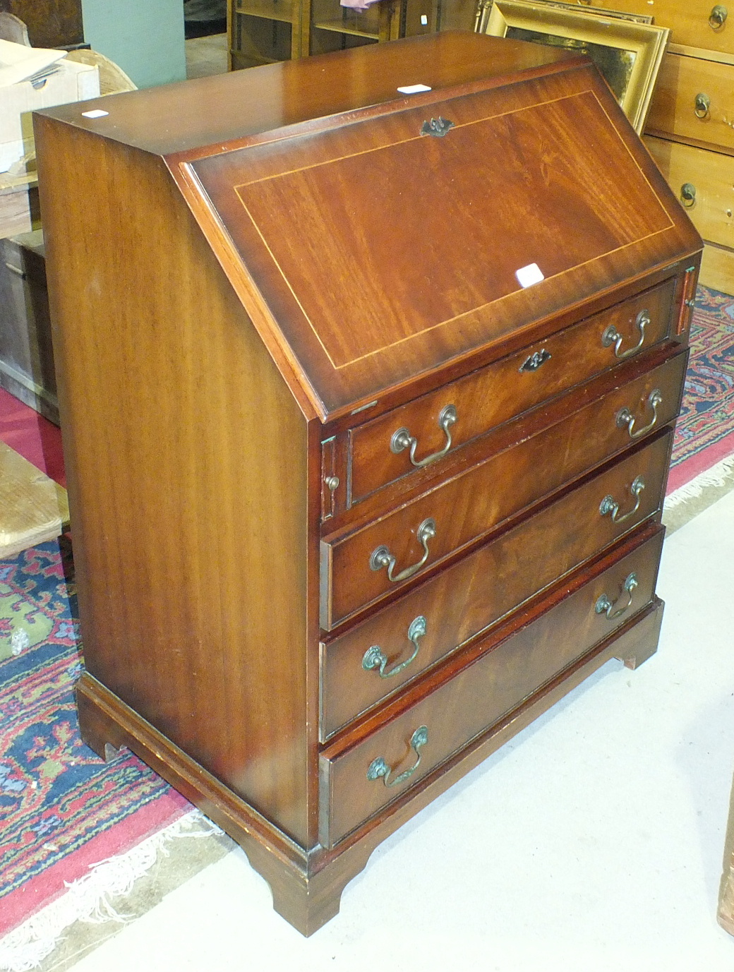A reproduction mahogany bureau, 74cm wide.