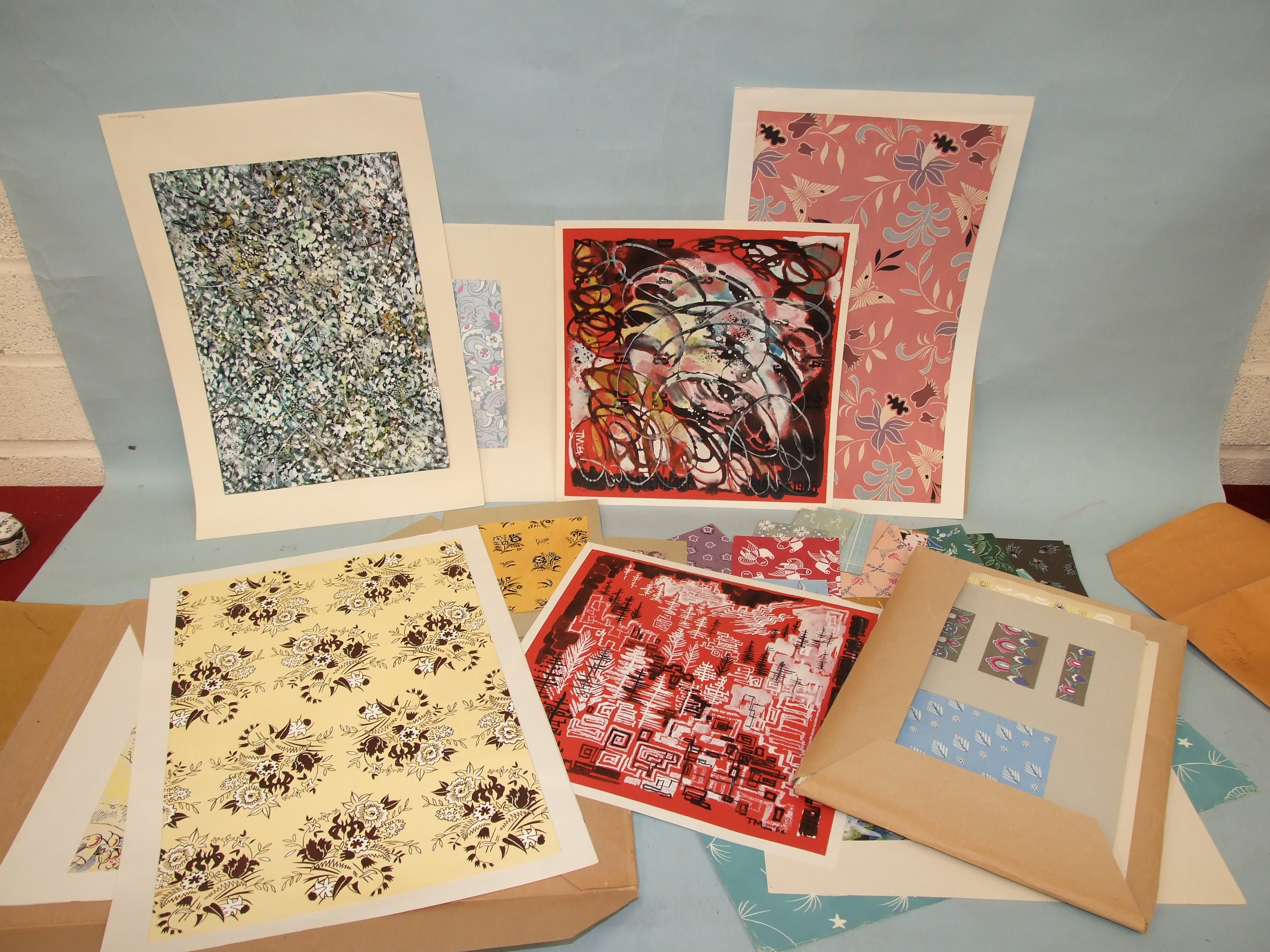 Three folders of watercolour and printed designs for fabrics. This lot is subject to the Artist’s