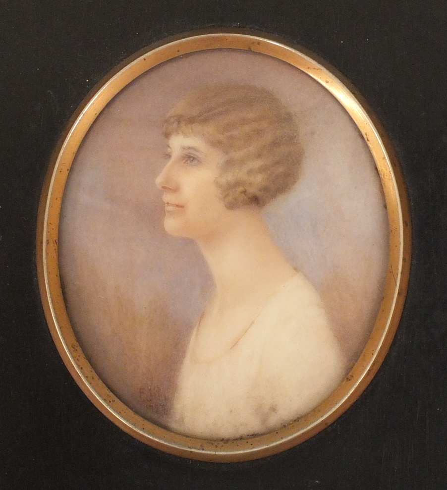 A miniature portrait of a young woman wearing a white dress, in oval mount, indistinctly initialled