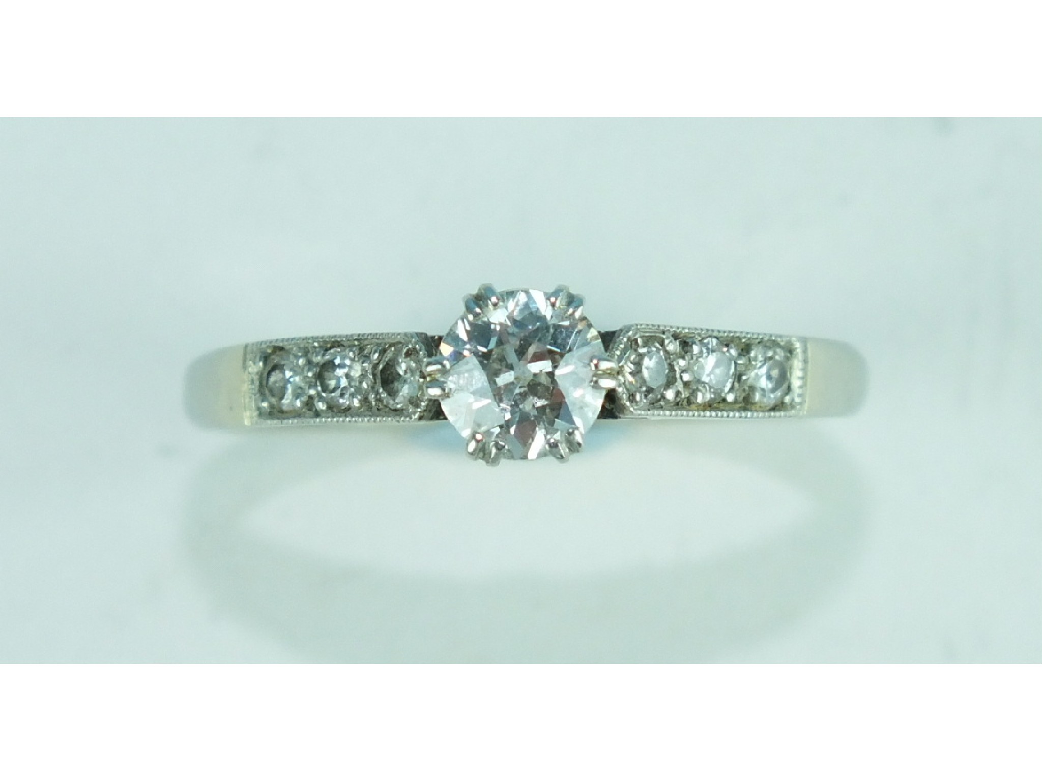 A solitaire diamond ring claw set a brilliant cut diamond of approximately 0.45cts in 18ct white