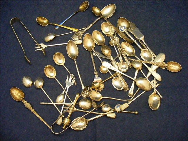 A collection of silver spoons etc