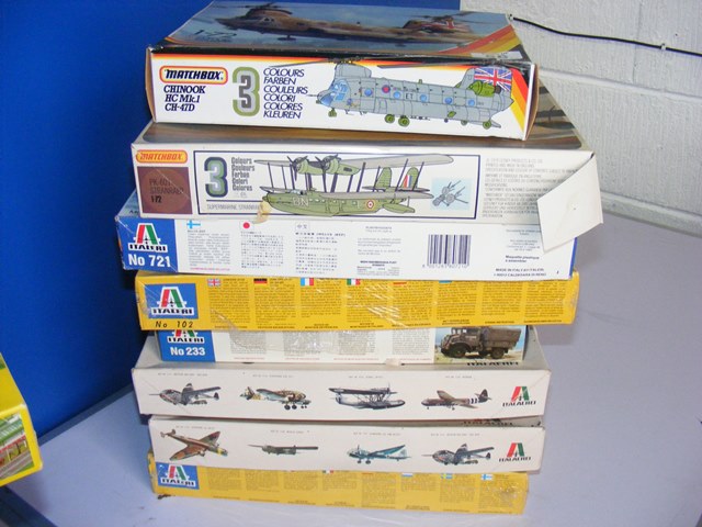 A Matchbox Chinook and Matchbox Supermarine Stranraer model kit together with 7 Italeri model kits