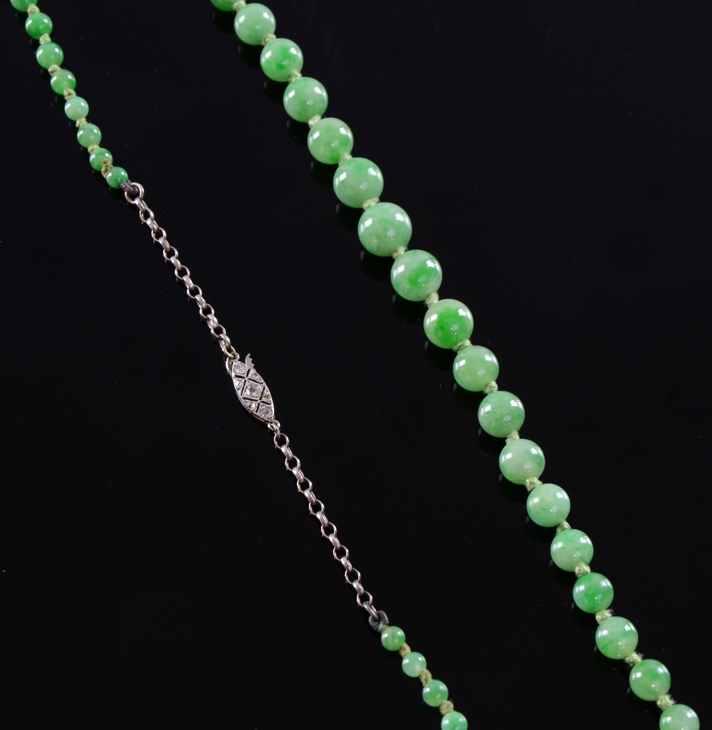 Edwardian Jade necklace of graduated beads to a diamond set gold clasp Beads graduating from 9.4