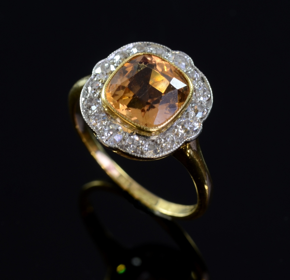 Edwardian yellow topaz and diamond ring in a millgrain setting in white and yellow gold stamped 18ct