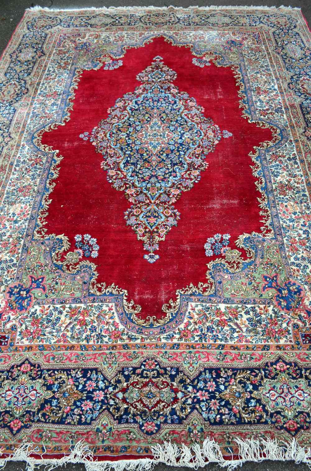 Persian blue ground carpet multiple borders the centre decorated with repeating foliate forms 14` 3"