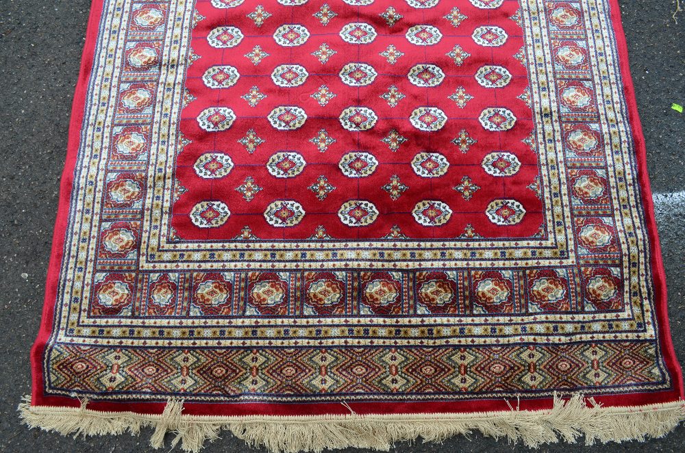 Red ground Kashmir rug with a Bokhara design, 200cm x 140cm - Image 3 of 5