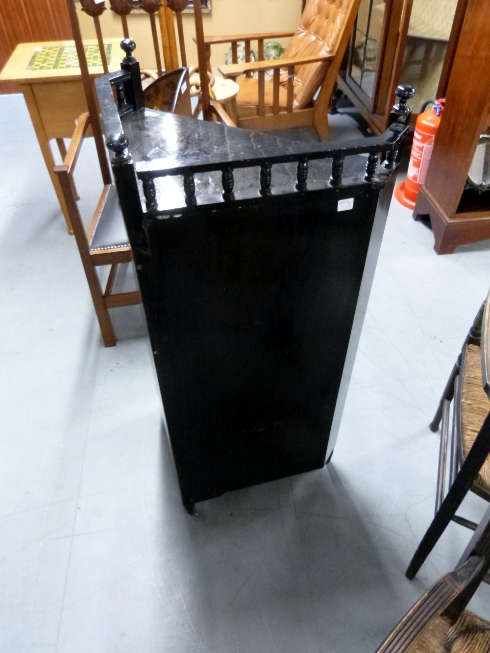 Ebonised corner cupboard in the manner of E. W. Godwin with gilt decorated panels depicting birds - Image 7 of 7