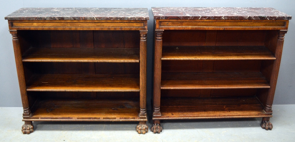 Close pair of early 19th century mahogany bookcases with marble tops on reeded column supports to