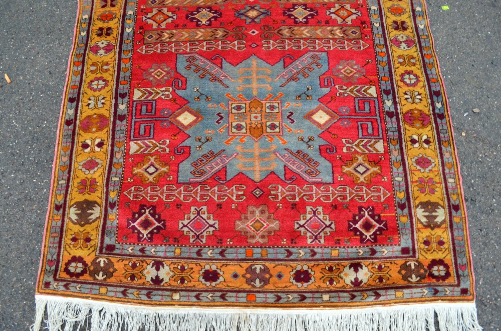 Persian red ground carpet, main yellow border the centre decorated with a pair of shaped blue - Image 2 of 5