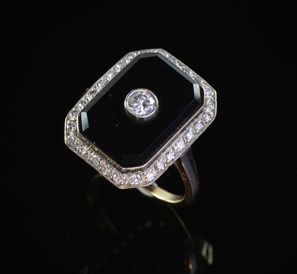 Art Deco onyx and diamond plaque ring Round brilliant cut diamond to centre on a rectangular onyx