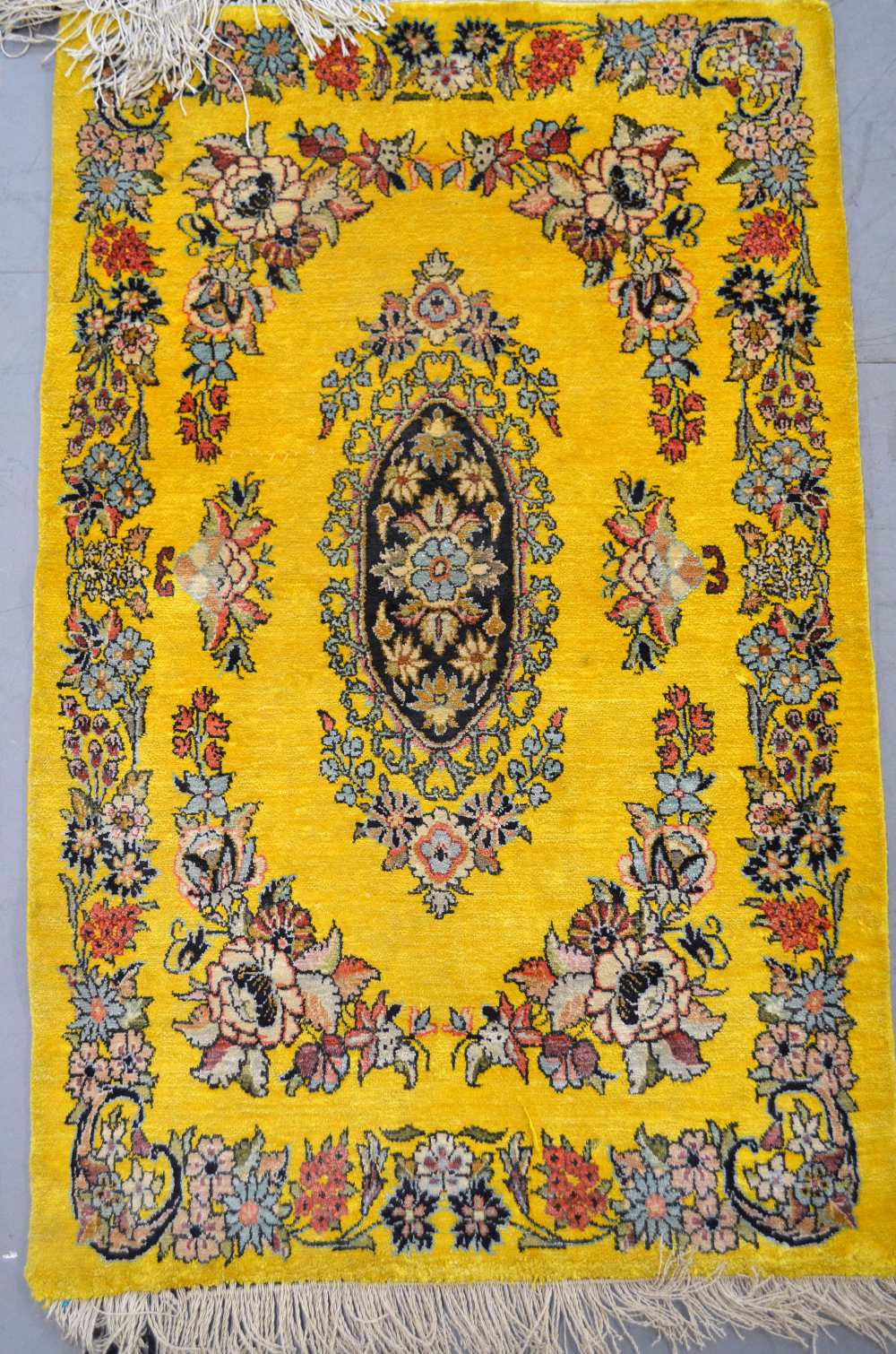 Yellow ground part silk rug 37 x 23in. (94 x 58cm)