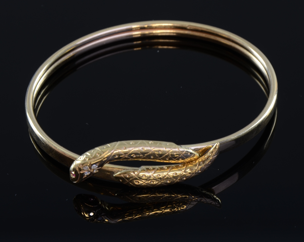Gold snake bangle the head set with diamond and ruby continental marks 9ct goldGood condition ,