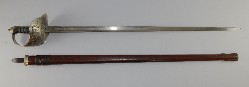 Early 20th century officer`s sword in leather sheath 42" long overallBlade in good order, hand guard