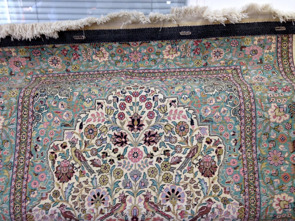 Silk Kashmir cream ground rug with a main green border centre decorated with foliate forms 72 x - Image 11 of 11