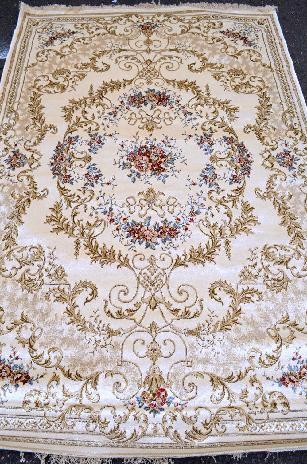 Ivory ground Kashmir rug with a classical floral design, 2.4m x 1.6m