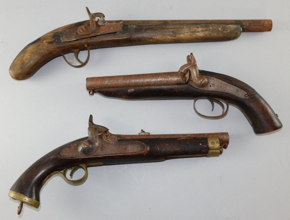 19th century flint lock pistol and two othersCondition very poor.  Pistol at bottom of image -
